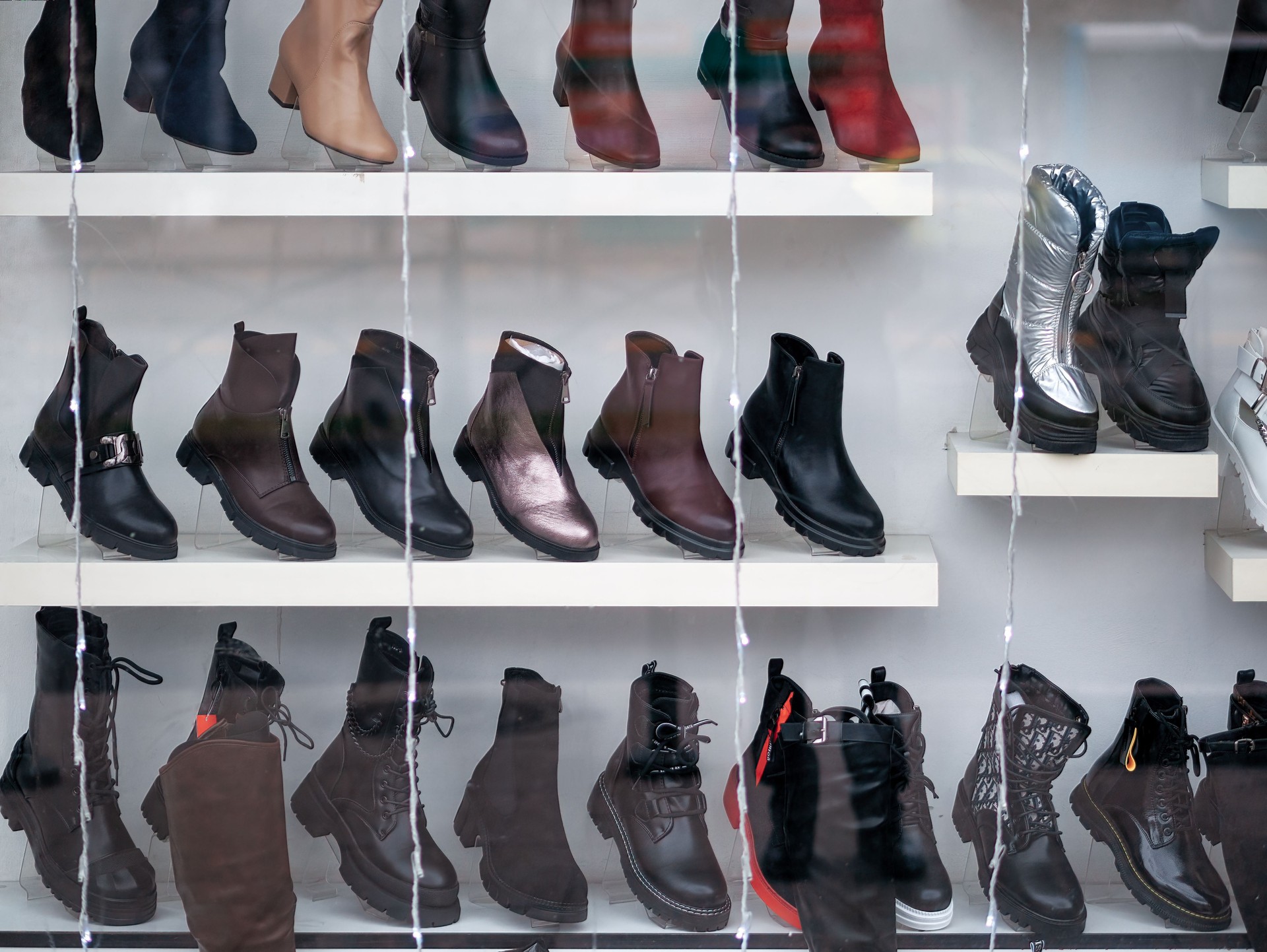 Display of natural leather shoes in the window store.