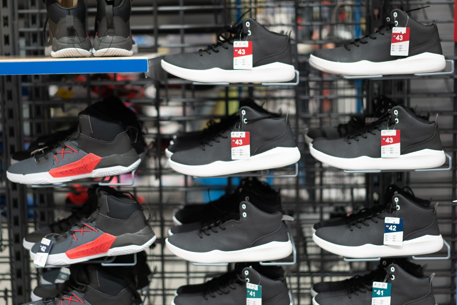 Fashion Casual Male Sport Shoes On Shelves In Store Of Shopping Center
